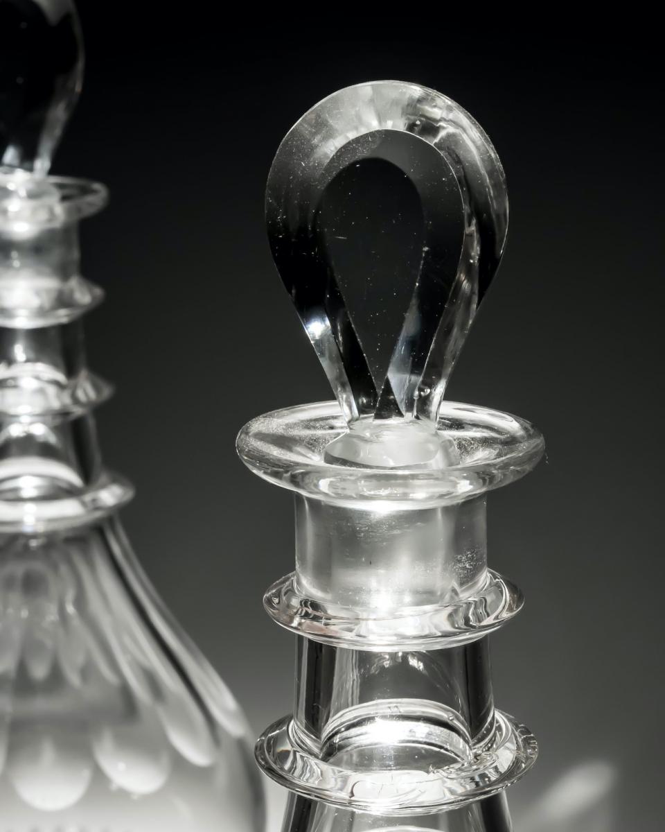 A Pair of Slice and Flute Cut Decanters