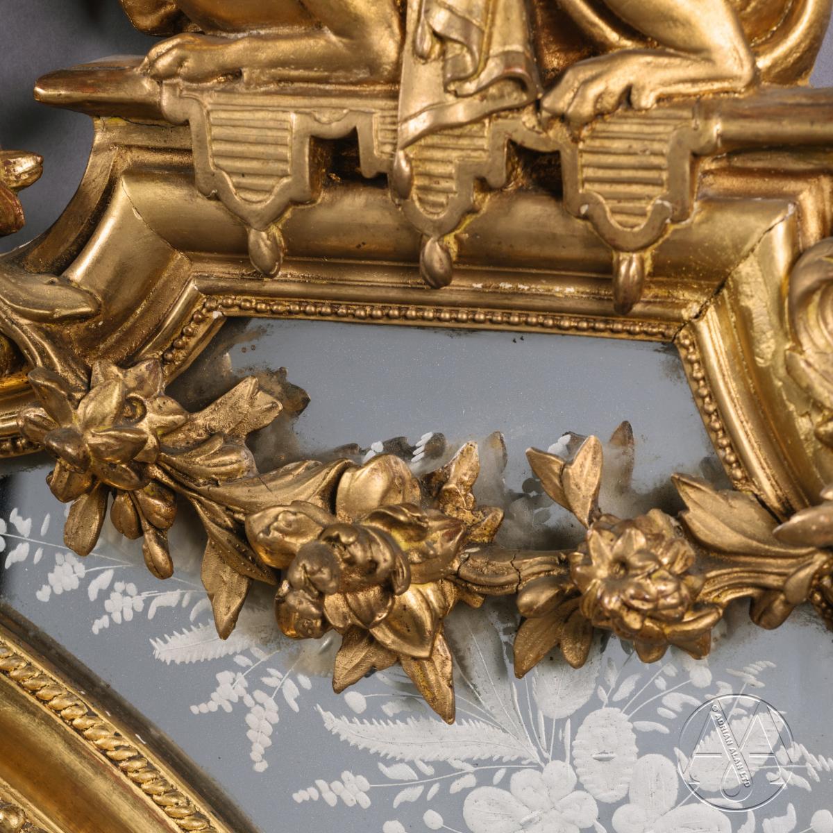 A Louis XIV Style Carved Giltwood Mirror