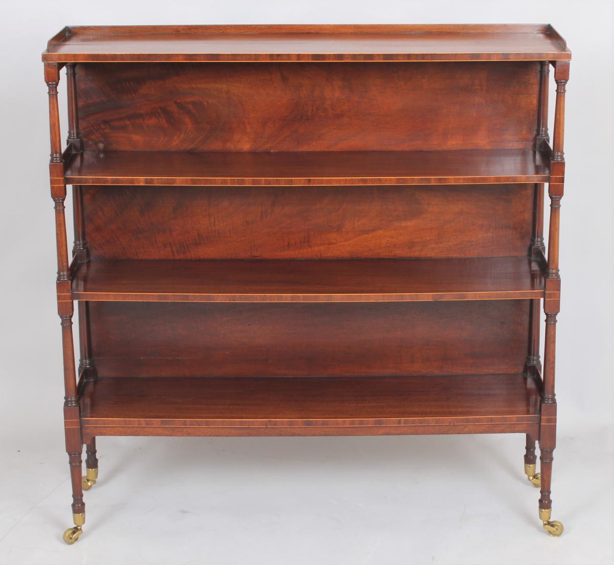 Fine George III mahogany and boxwood strung four tier open shelves