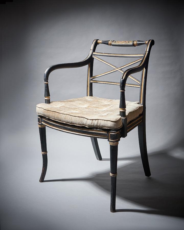 George III Armchair in ebonised beech with a caned seat and gilt decoration