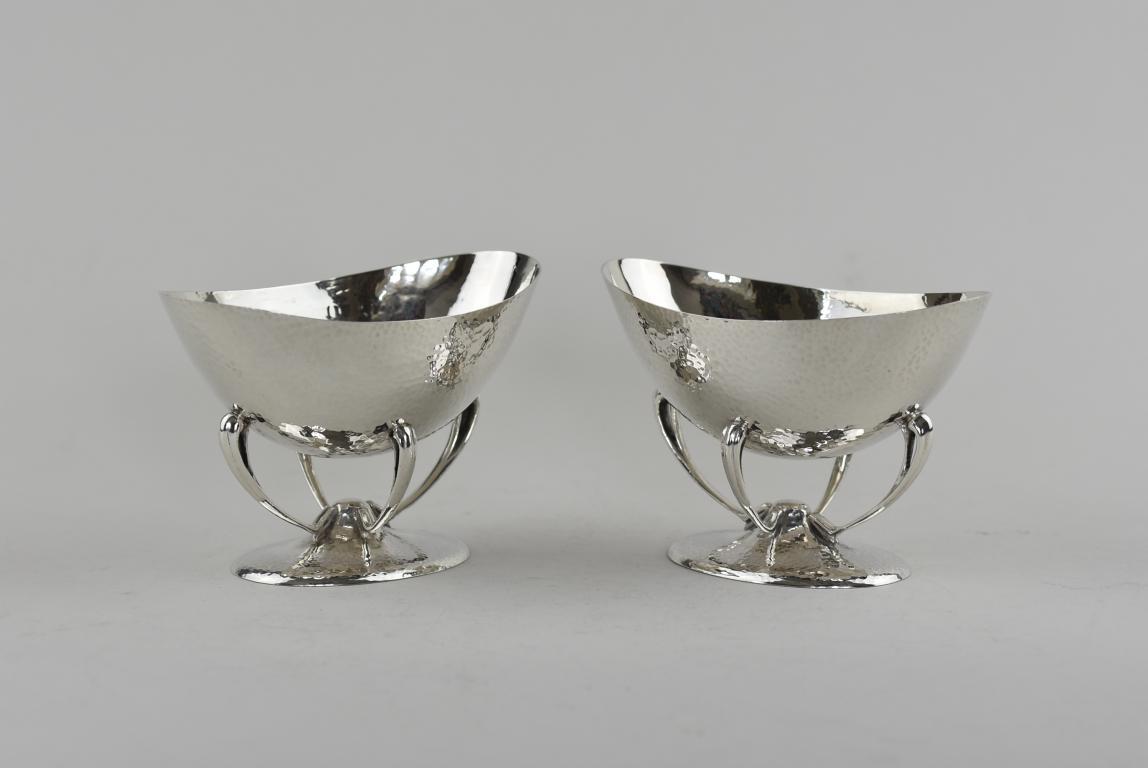 A pair of Arts and Crafts hammered silver dishes