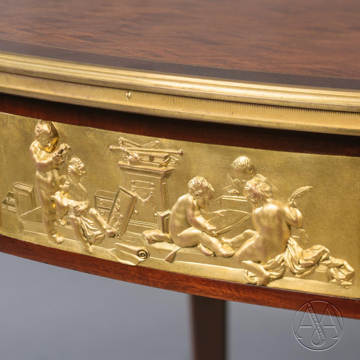 Detail of the bronze mounts to a Fine Louis XVI Style Parquetry Inlaid Centre Table, By François Linke