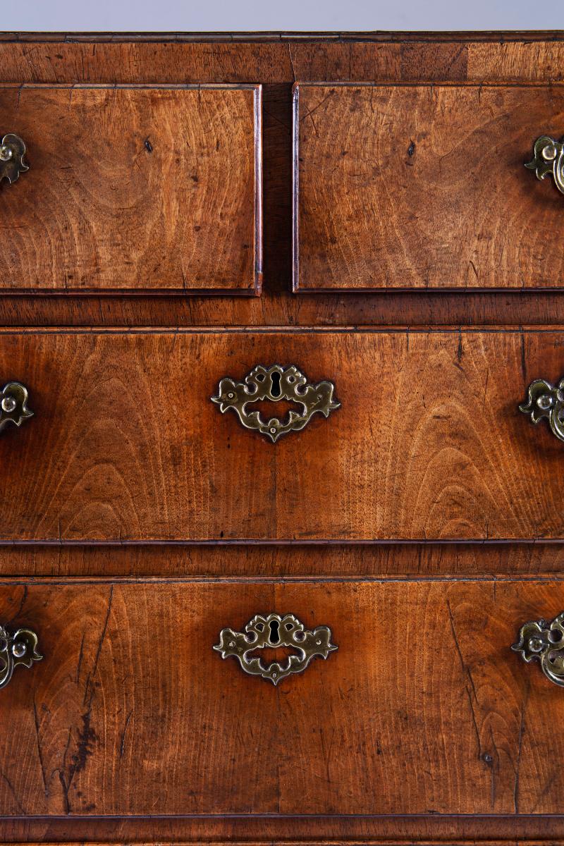 A George II walnut chest of drawers