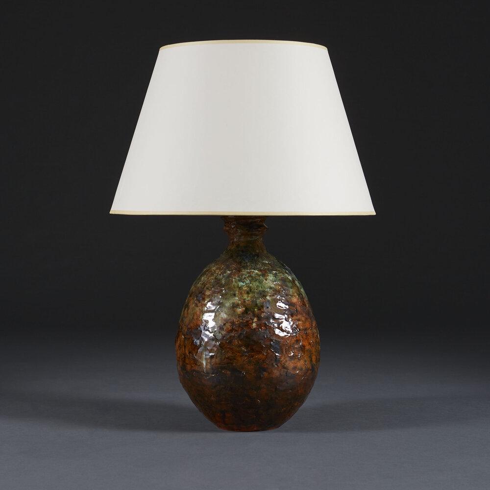 An Unusual Art Pottery Lamp with Volcanic Glaze
