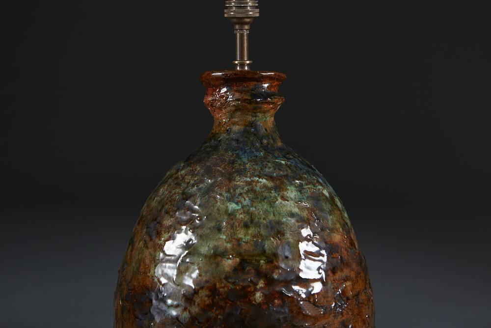 An Unusual Art Pottery Lamp with Volcanic Glaze