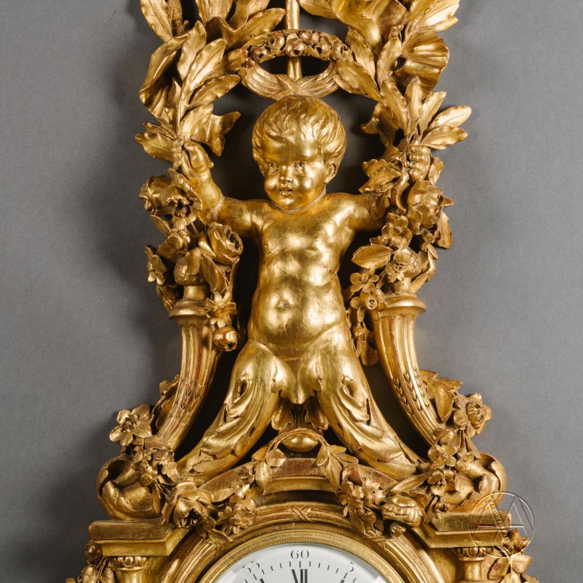 A Detail of A Large Louis XVI Style Carved Giltwood Clock and Barometer Set Dating From Circa 1860