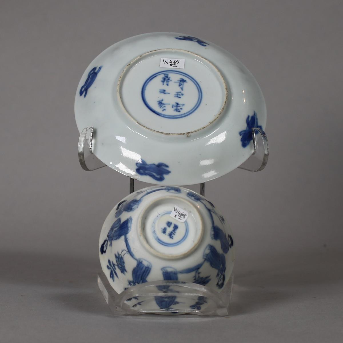 base of blue and white cup and saucer