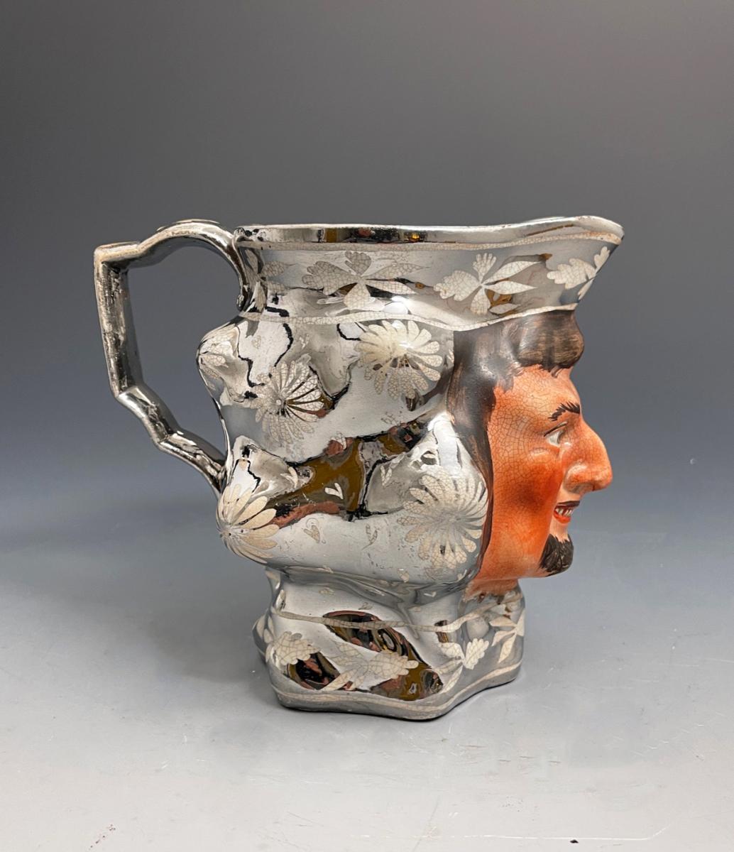 English pottery pitcher with silver lustre and face of a Bacchus early 19th century