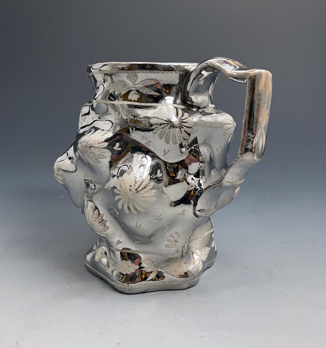 English pottery pitcher with silver lustre and face of a Bacchus early 19th century