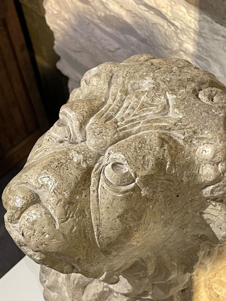 A MAGNIFICENT AND EXTREMELY RARE PAIR OF LATE ROMANESQUE ITALIAN LIMESTONE LION SUPPORTS. CIRCA 1320.