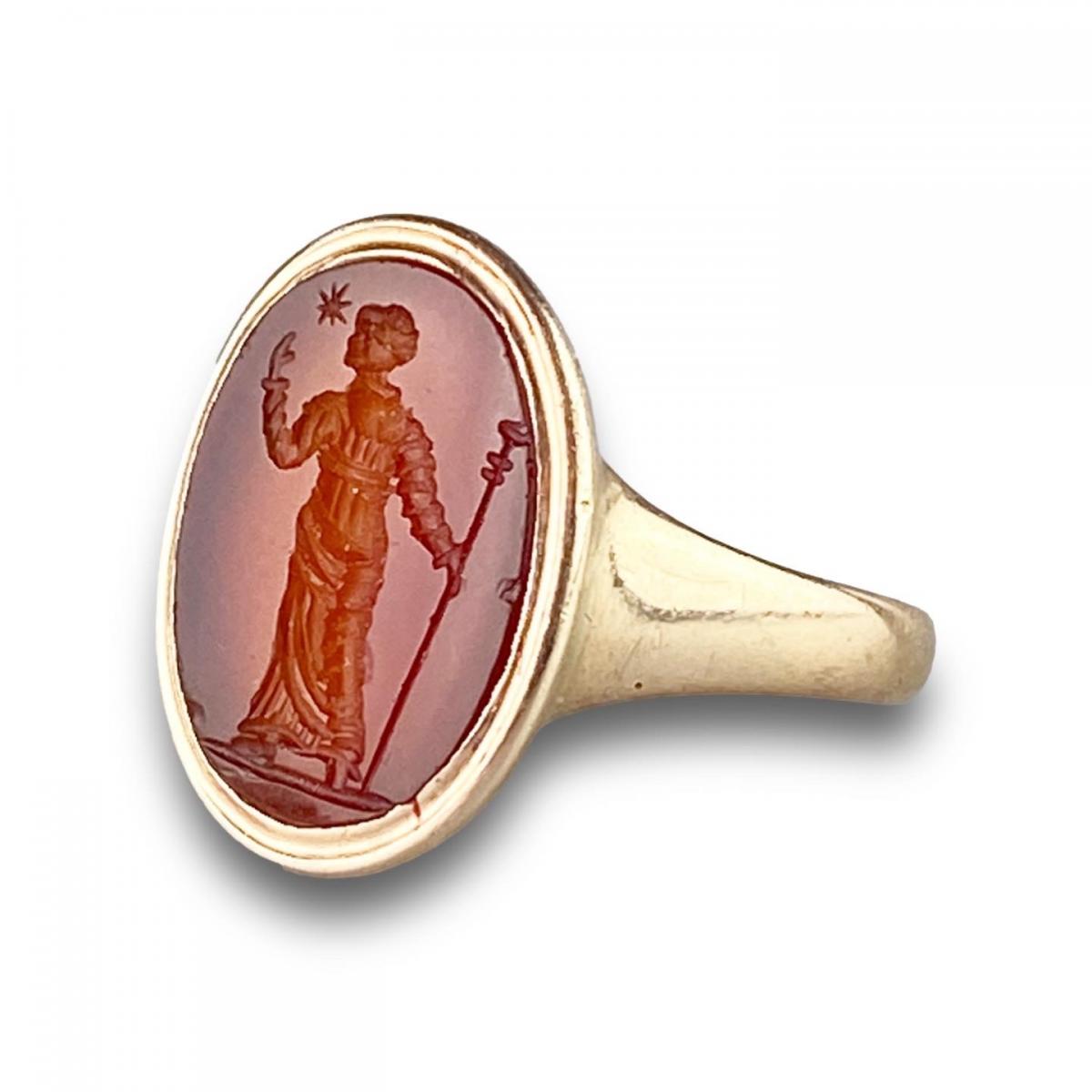 Gold ring with a carnelian intaglio of a woman. Italian, 18th-19th centuries