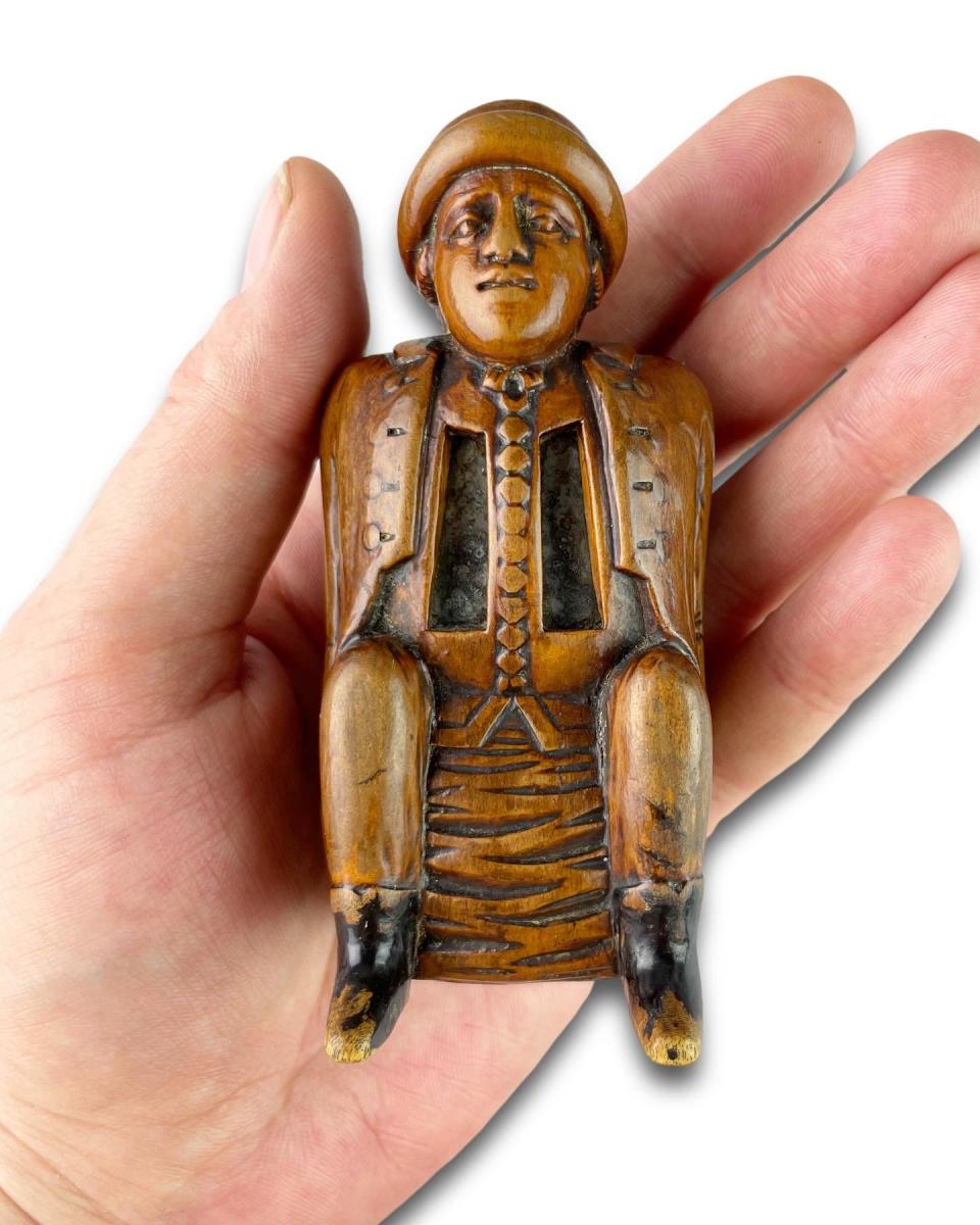 Fruitwood snuff box carved as a coachman relieving himself. Dutch, circa 1780