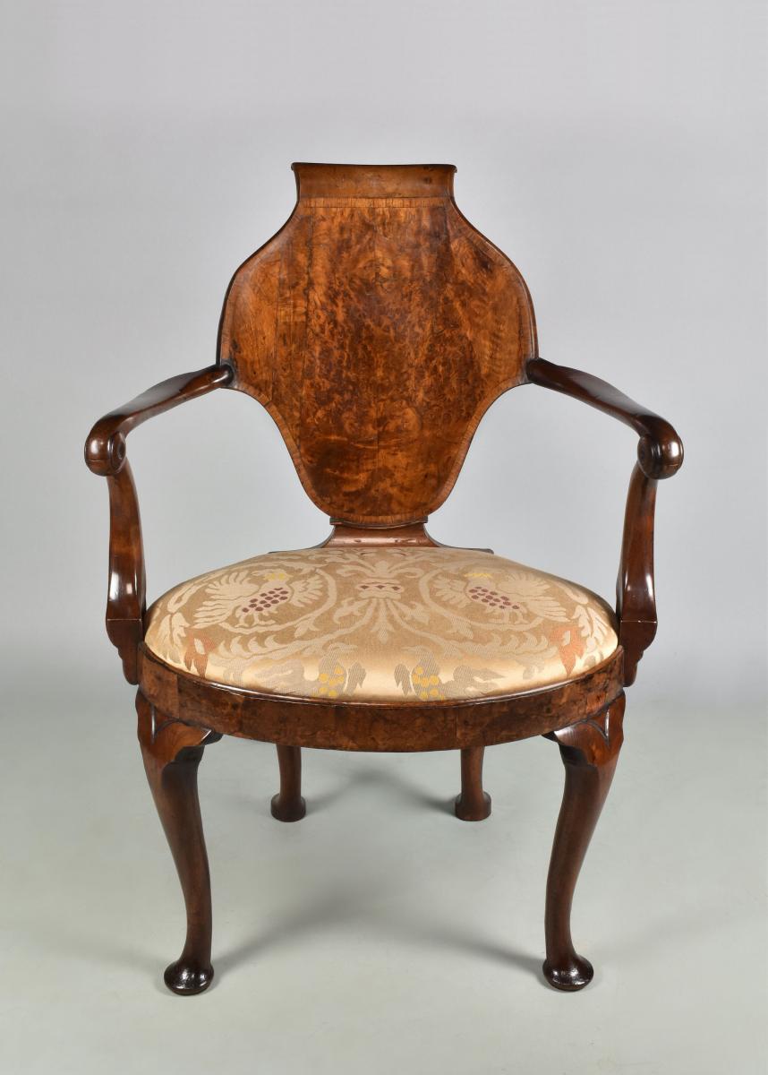 Queen Anne walnut escutcheon back writing chair, c.1710