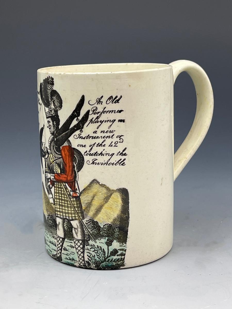 English creamware pottery tankard with a Highlander playing Bagpipes formed as Napoleon circa 1802
