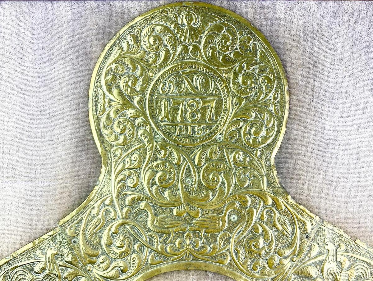 Repoussé brass saddle decoration dated 1787. Spanish, circa 1787