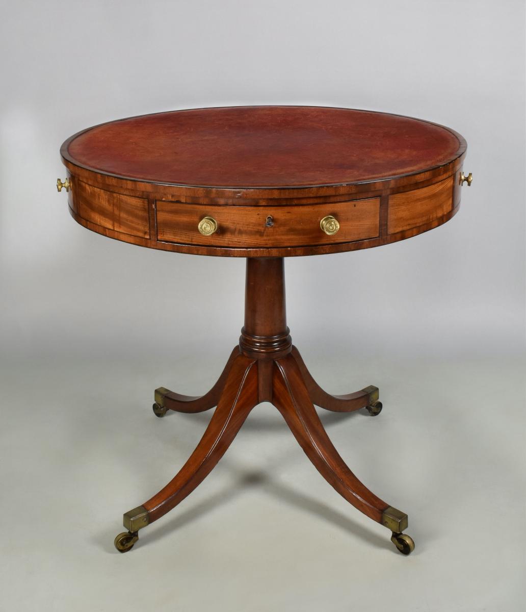 A small George III mahogany revolving drum table, c.1800