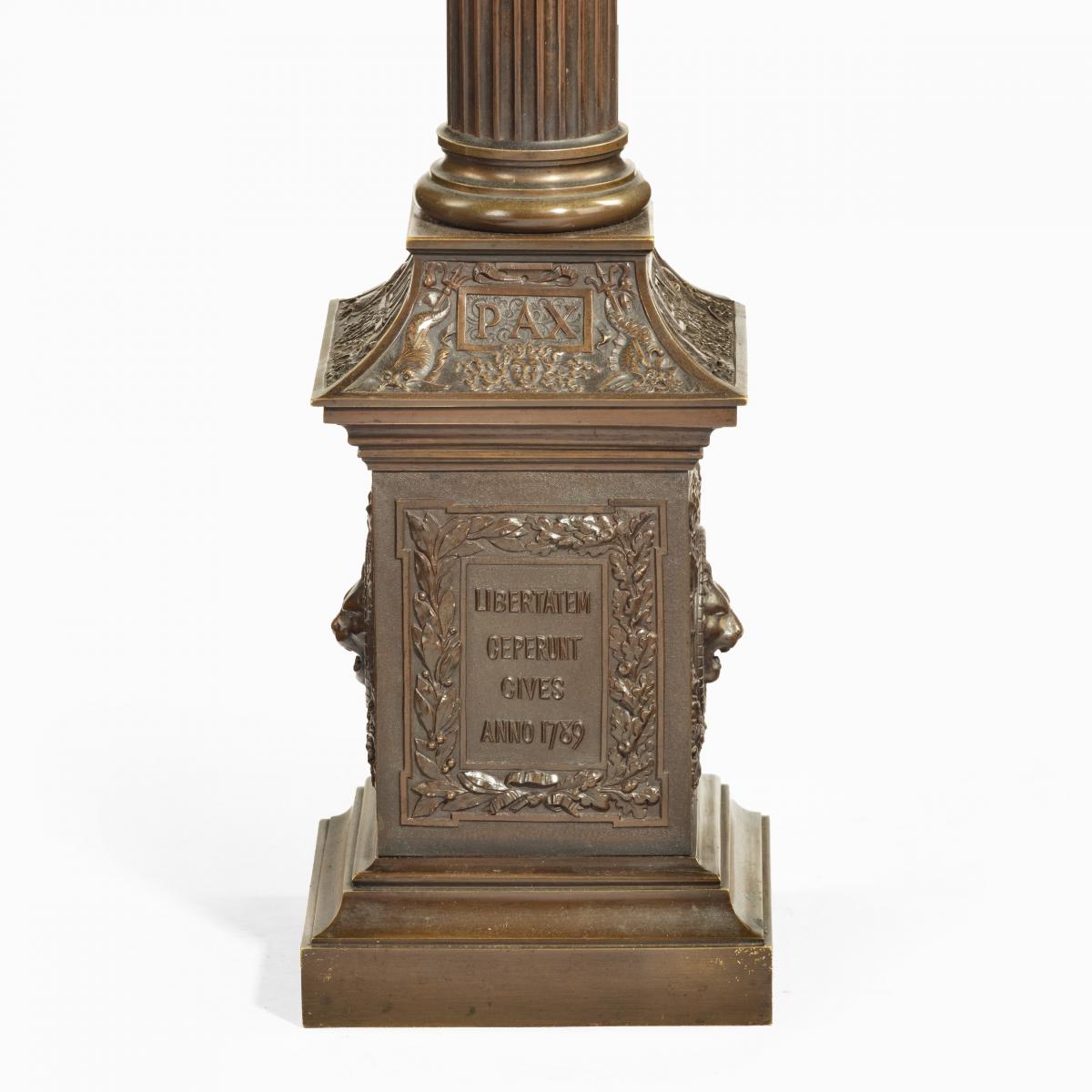 A bronze column depicting ‘La Colonne de la Republique’ dated 1889, after Paul LeCreux