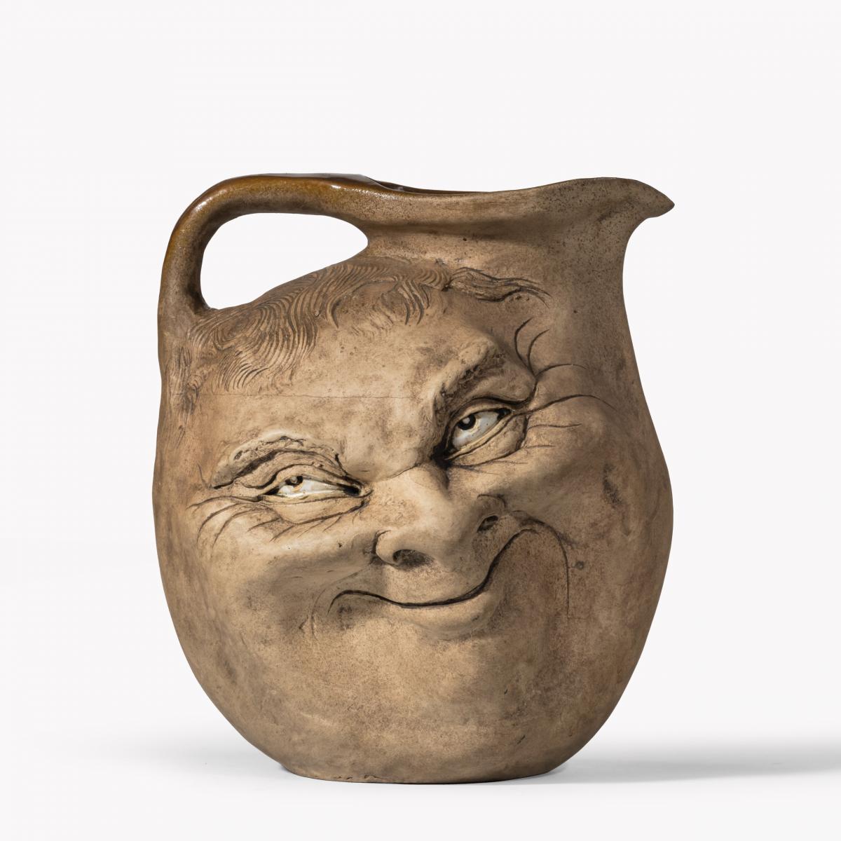 A Martinware double-sided stoneware pottery ‘face’ jug, dated 1896