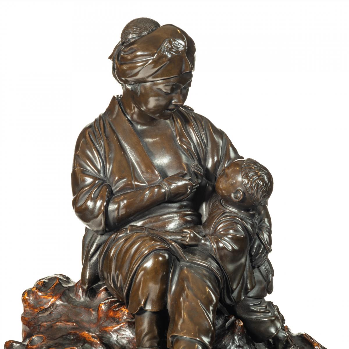 A Meiji period bronze sculpture of a mother and son by Atsuyoshi