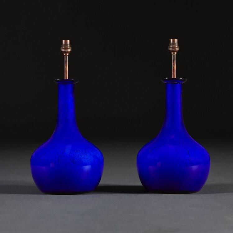 A Pair of Cobalt Blue Glass Bottle Lamps
