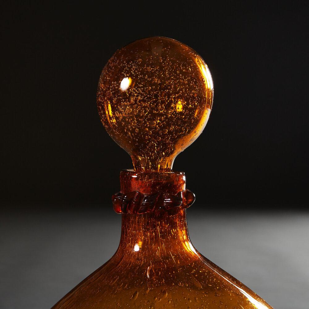 A Rare Overscale Amber Glass Vessel With Stopper