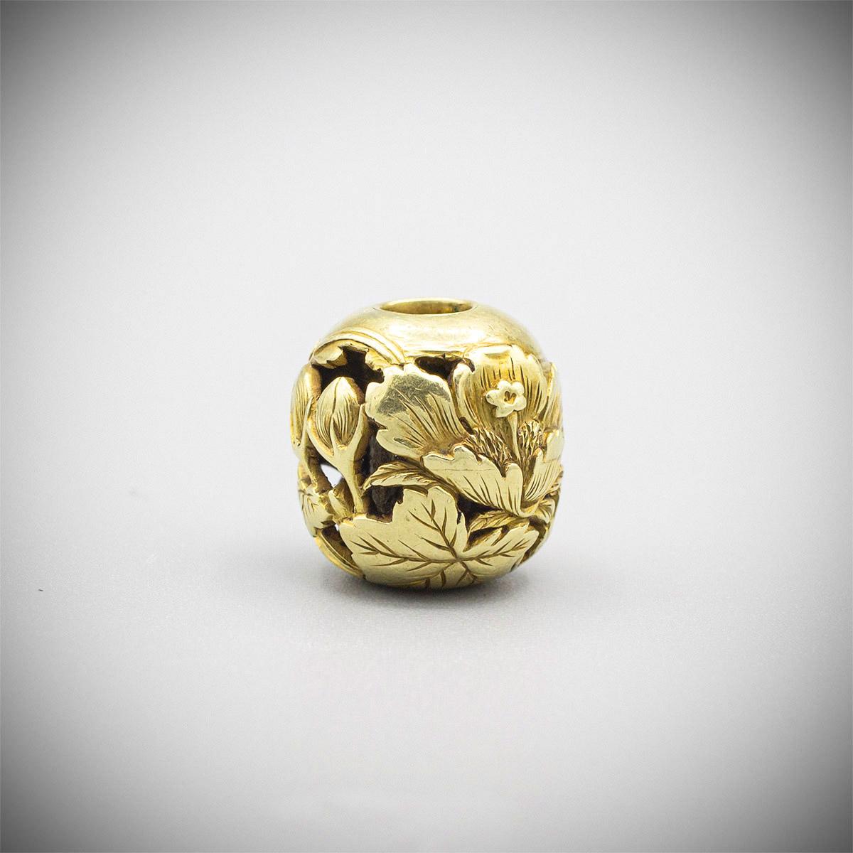 Carved Gold Ojime with Butterfly and Hibiscus