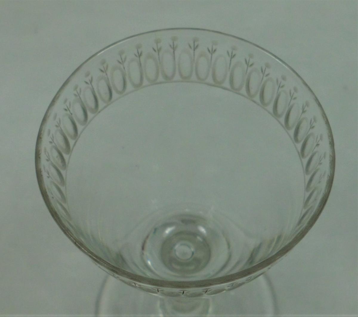 A plain stem wine glass engraved with an egg & dart border, English circa 1780