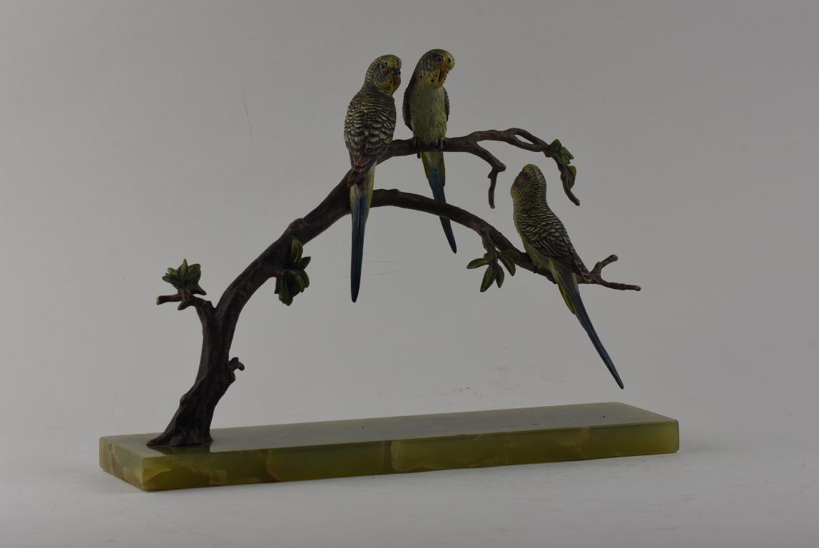 An Austrian cold painted bronze group of 3 Budgerigars perched on branches