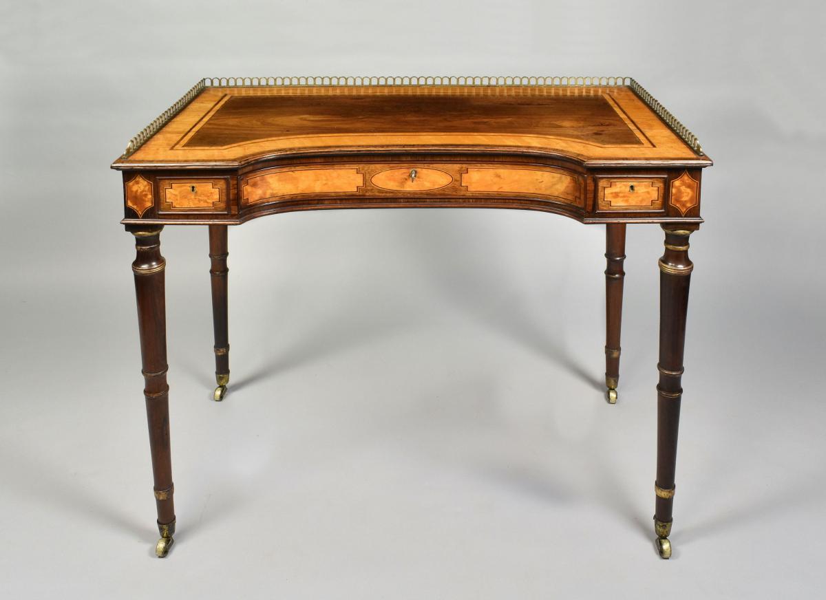 A fine Sheraton rosewood, satinwood and parcel gilt writing table, c.1790