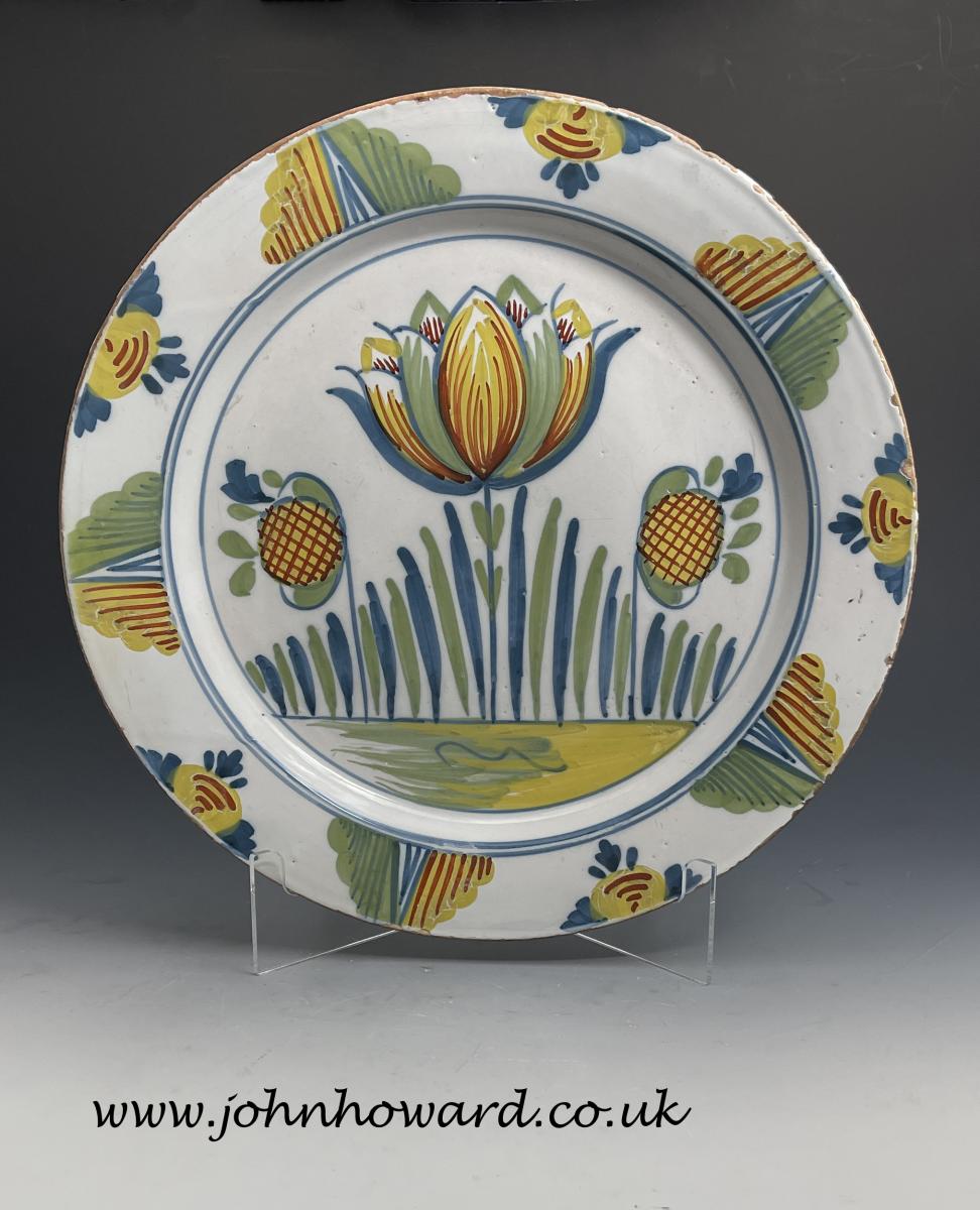 English delftware polychrome decorated dish, 18th century