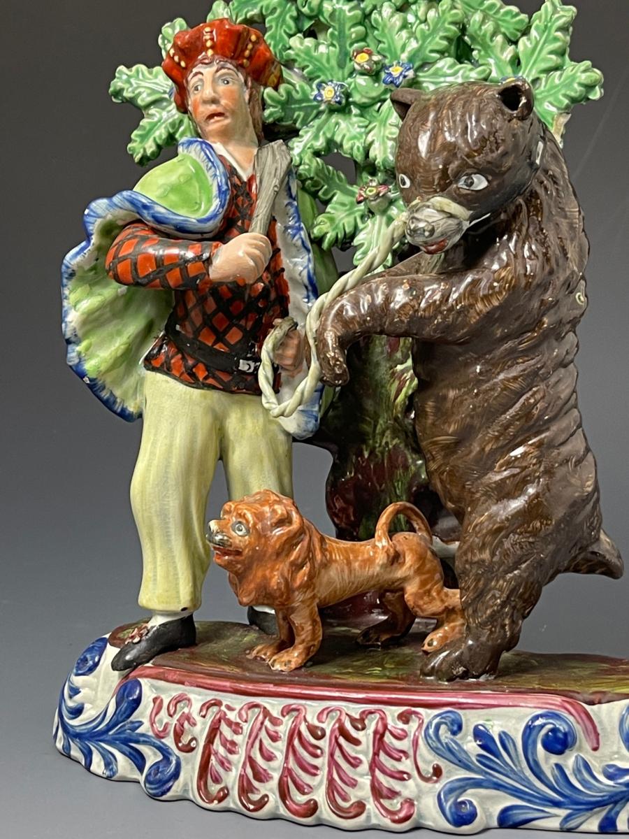 Staffordshire pottery figure group of a Savoyard with bear and lion circa 1820 English