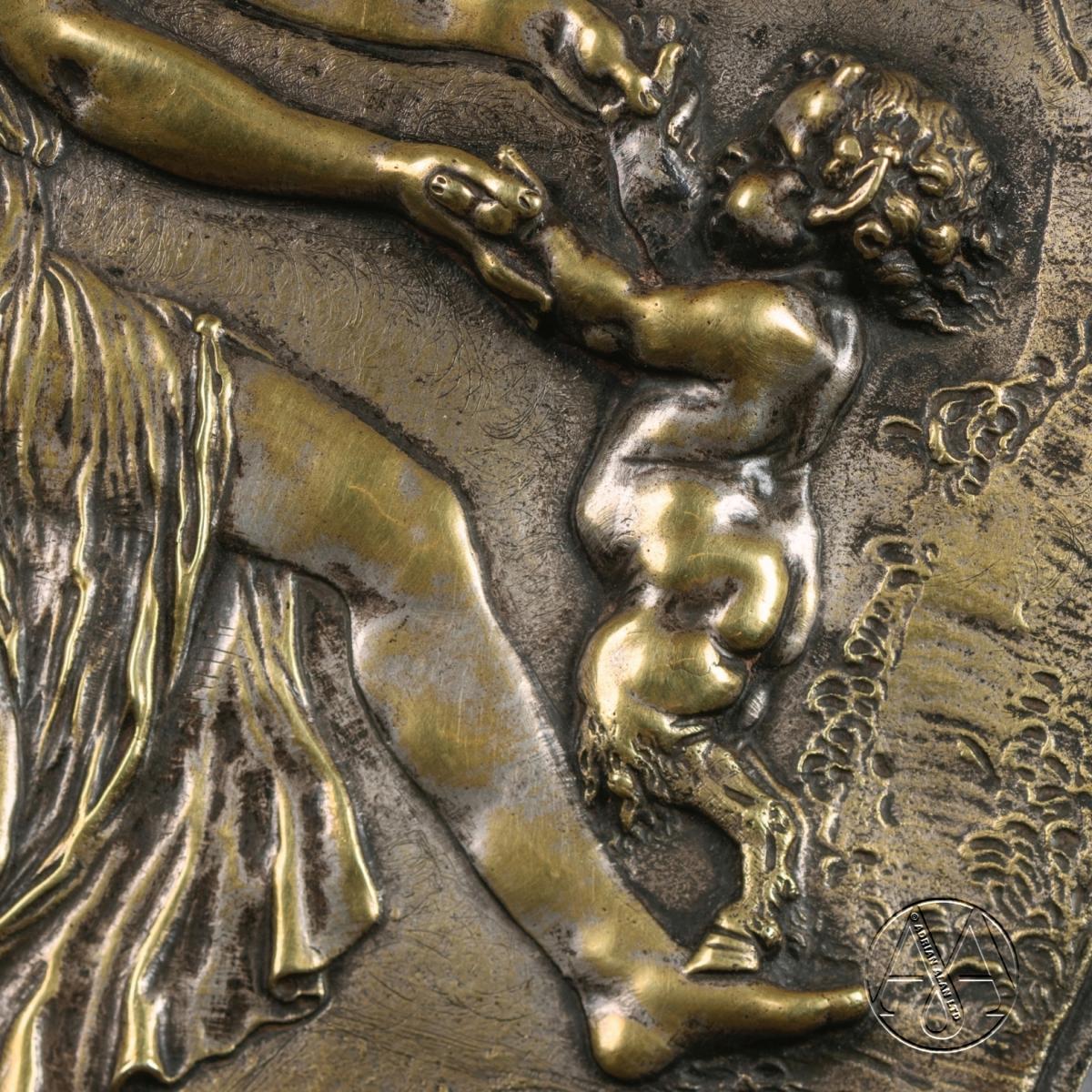 A detail of a Pair of Oval Bronze Reliefs After Clodion