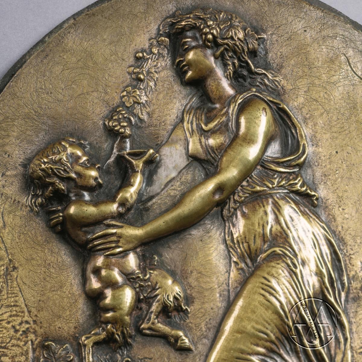A detail of a Pair of Oval Bronze Reliefs After Clodion