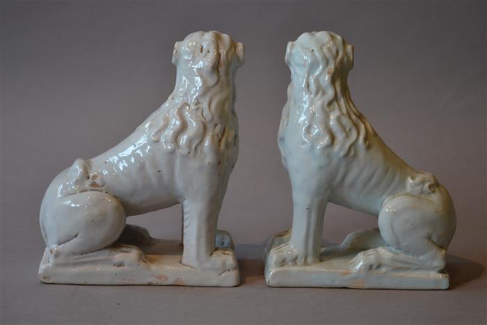A pair of 18th century white tin glazed lions