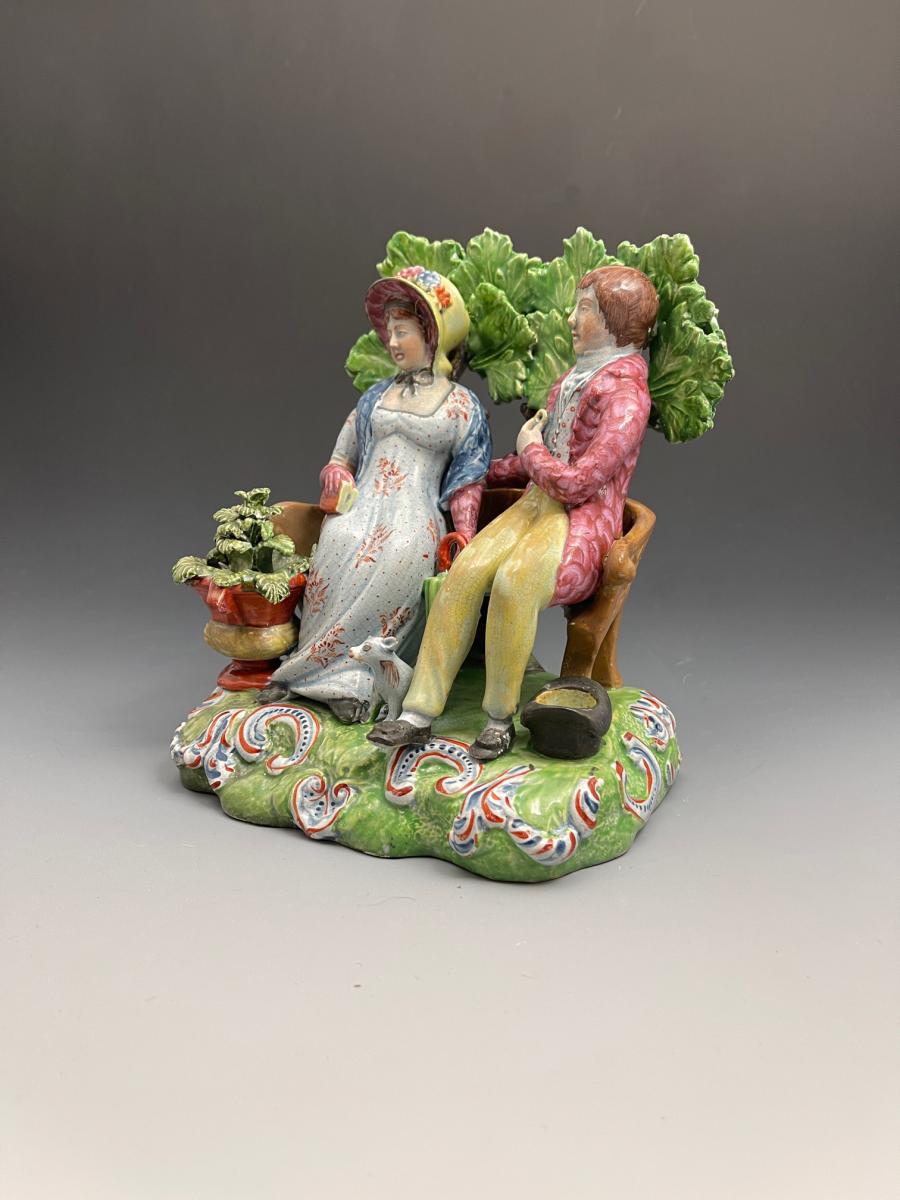Antique Staffordshire pottery bocage figure group of Persuasion early 19th century