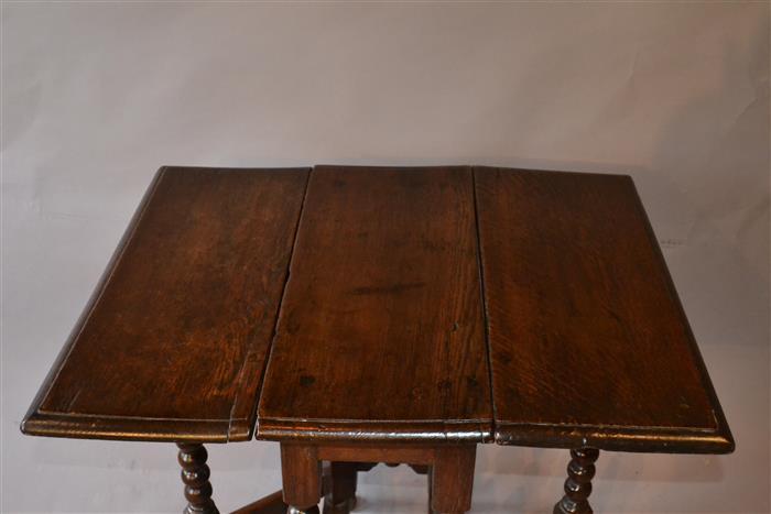 A very small William and Mary oak gateleg table