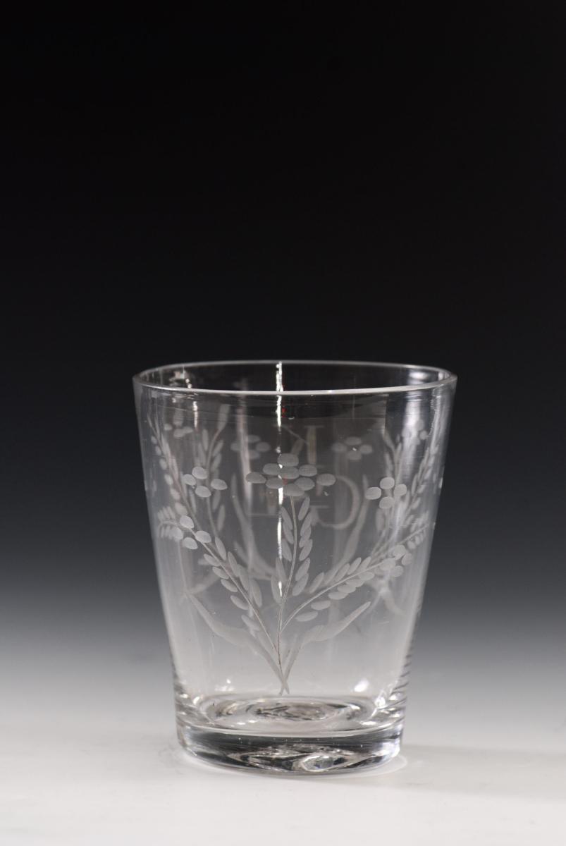 A tumbler engraved flowers