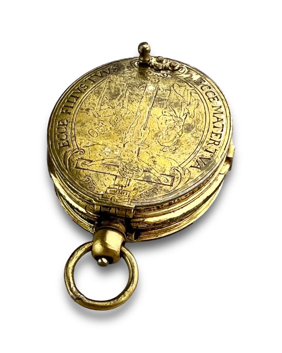 Engraved gilt metal portable pyx. French, early 17th century
