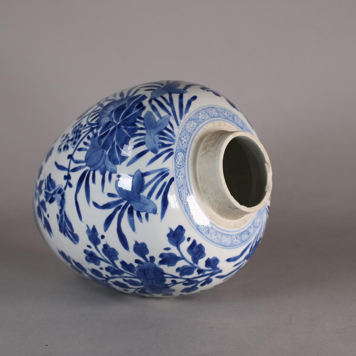 side view of blue and white jar