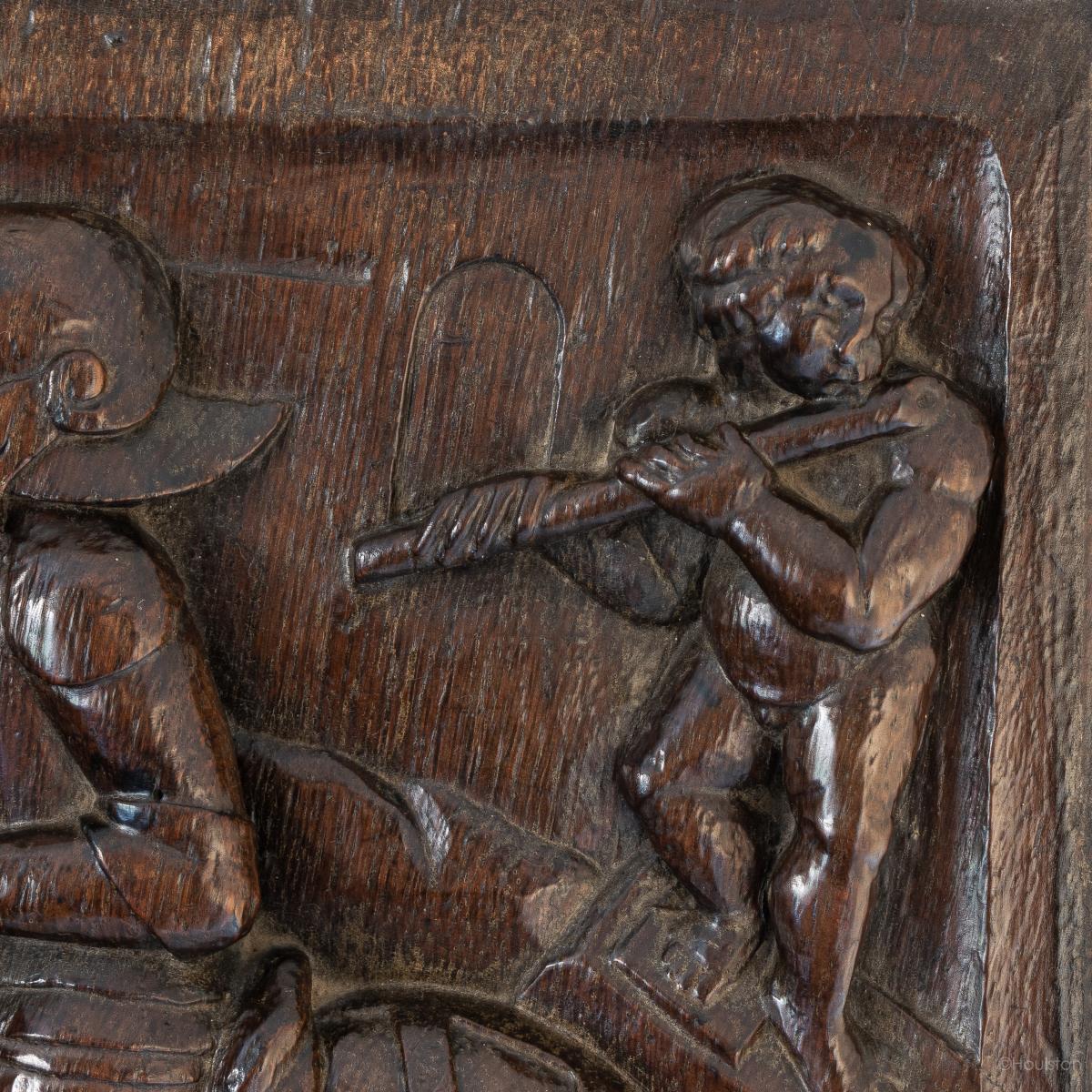 A fine Henry VII / VIII carved oak panel, St. George Slaying The Dragon, circa 1500-1530
