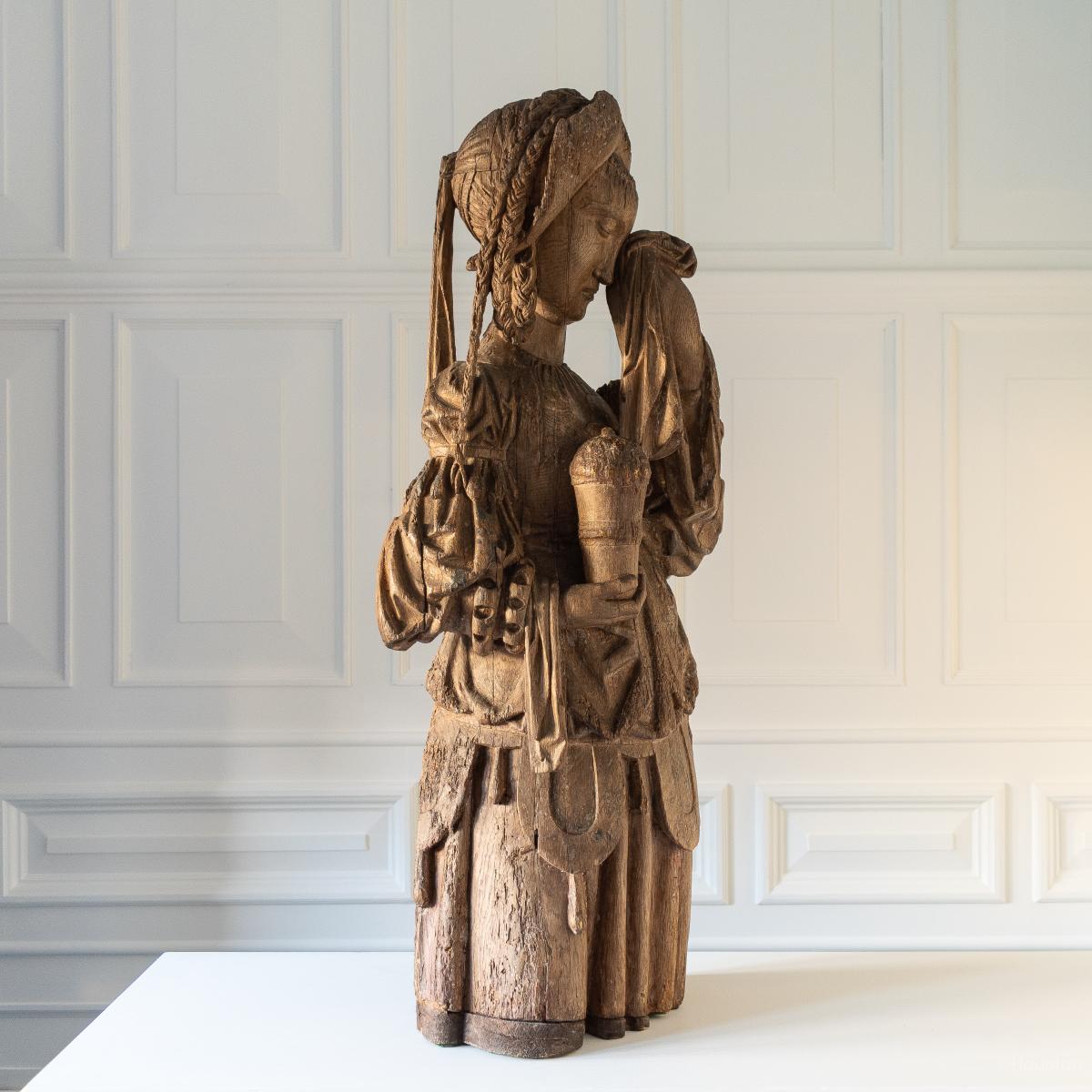 A fine carved oak figure, Mary Magdalene, traces of polychrome, Southern Netherlandish, Eastern France or South Western Germany, circa 1400-1425