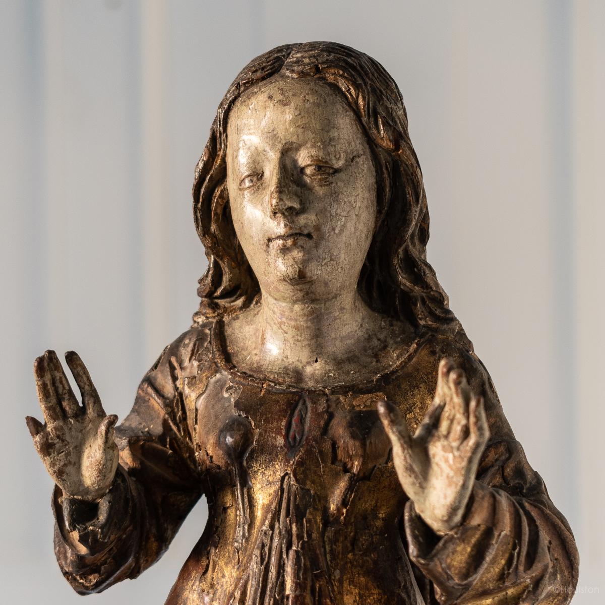 A gilt and polychromed limewood figure, Saint Mary Magdalene, South German, circa 1515