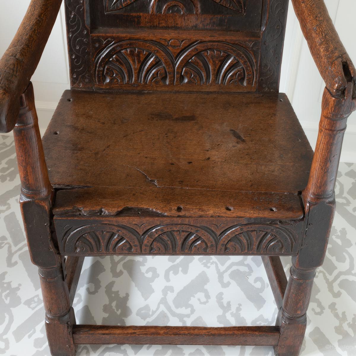 A documented Charles I oak panel-back open armchair, West Country, circa 1630