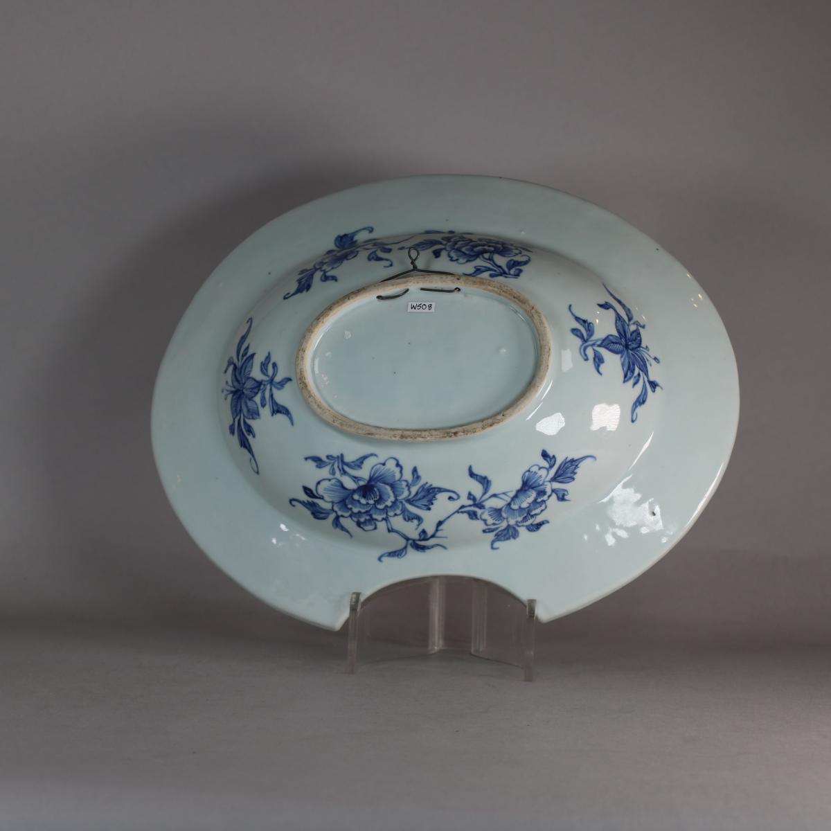 back view of blue and white barber's bowl