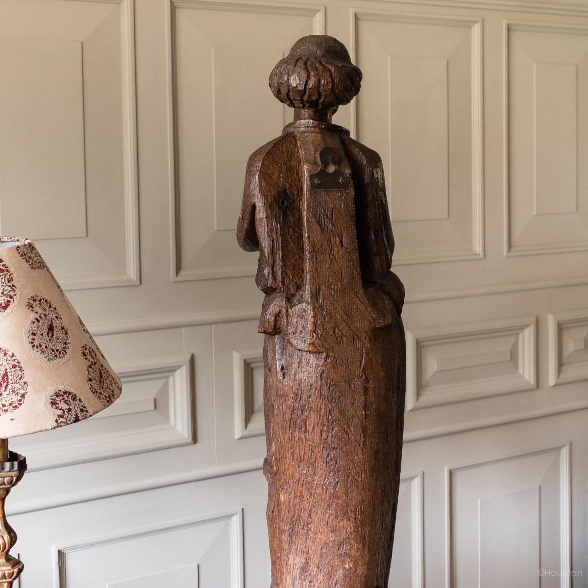 A 15th century carved oak figure, French, circa 1480