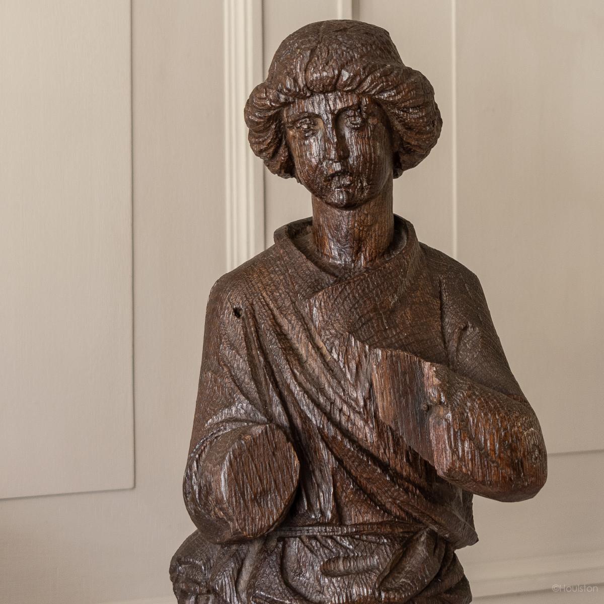 A 15th century carved oak figure, French, circa 1480