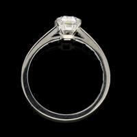 A 1.52ct emerald-cut diamond and platinum solitaire ring with baguette diamond set band