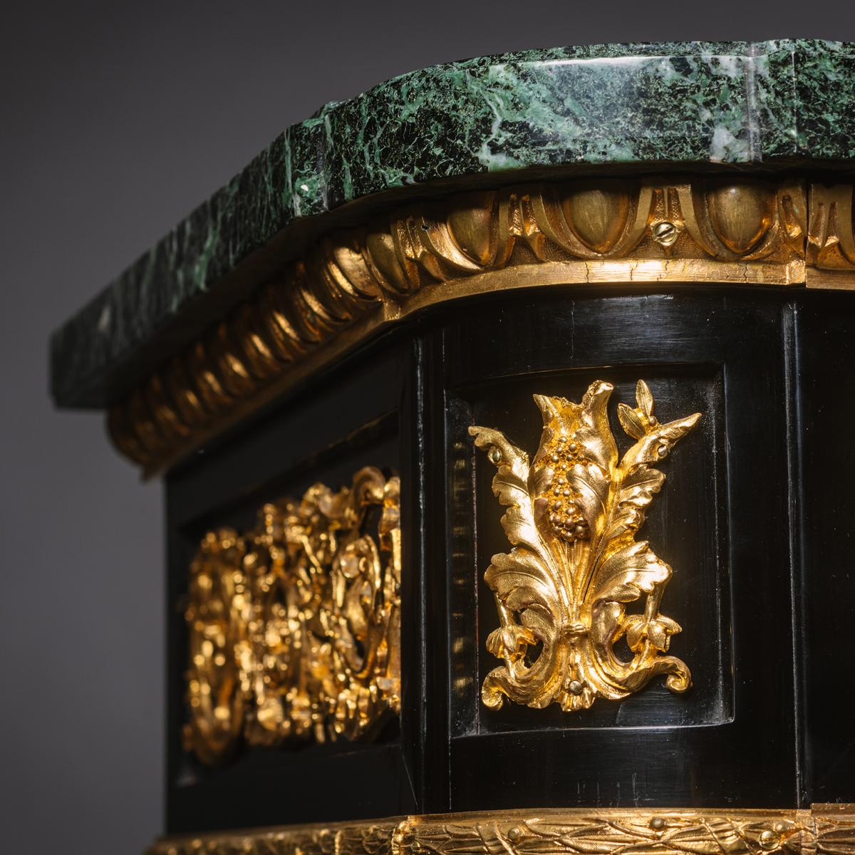 A detail of A Pair of French Gilt-Bronze Mounted Ebonised Meubles d'Appui 