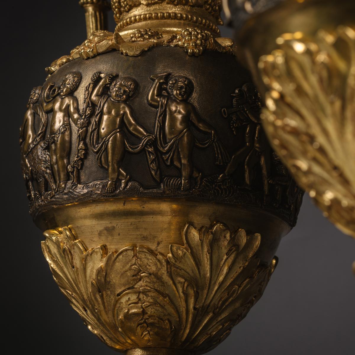 A detail of A Pair of Gilt and Patinated Bronze Ewers by Maison Giroux