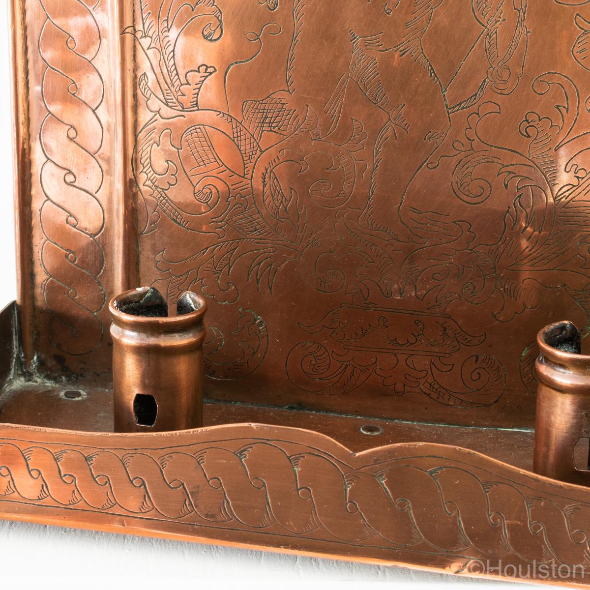 An attractive pair of sheet copper and engraved twin-light wall sconces, English or Scottish, circa 1905